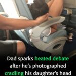 Dad sparks debate holding daughter’s head 45 mins while she slept on flight